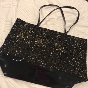 NWOT patent & sateen black w/ gold star tote.